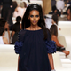 Image for article titled Chanel’s Resort 2015 collection combined sharia-friendly layers and a quilted gold gas-can purse
